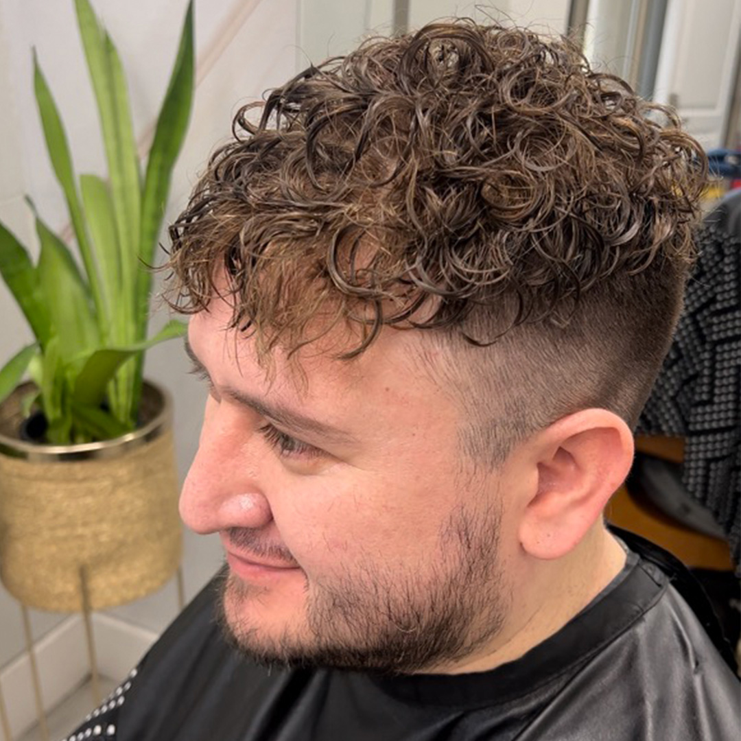 Finished curly men's hair system result at The Men's Grooming Suite